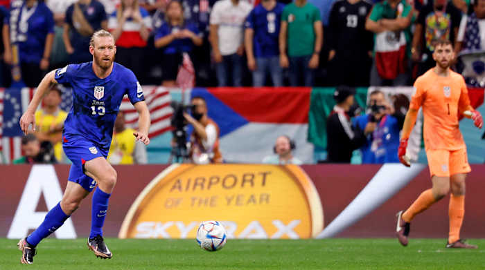 United States of America defender Tim Ream dribbles the ball against England.
